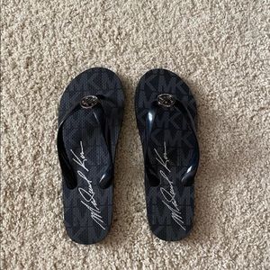 Black Michael Kors flip flops